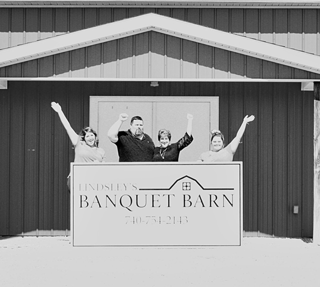 Lindsley family in front of Lindsley's Banquet Barn.